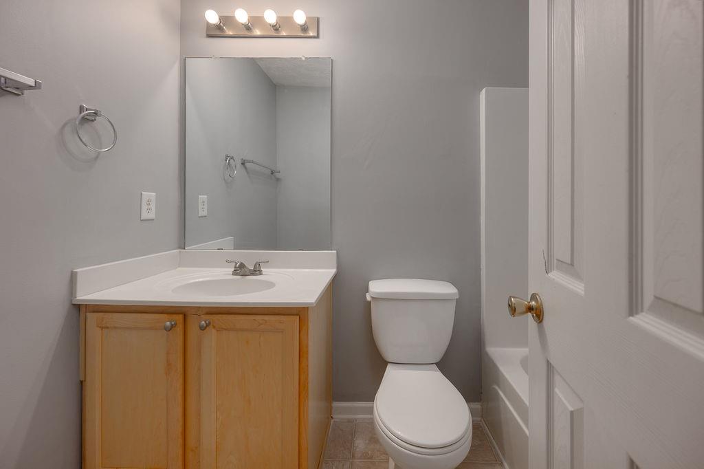 6280 Lake Valley Point Lithonia, GA 30058 - Photo 15 of 30 a bathroom with a toilet sink and mirror
