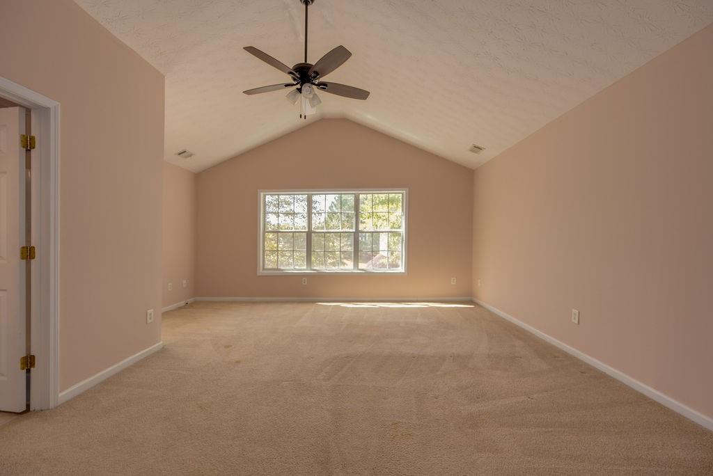 6280 Lake Valley Point Lithonia, GA 30058 - Photo 16 of 30 an empty room with a window and a fan