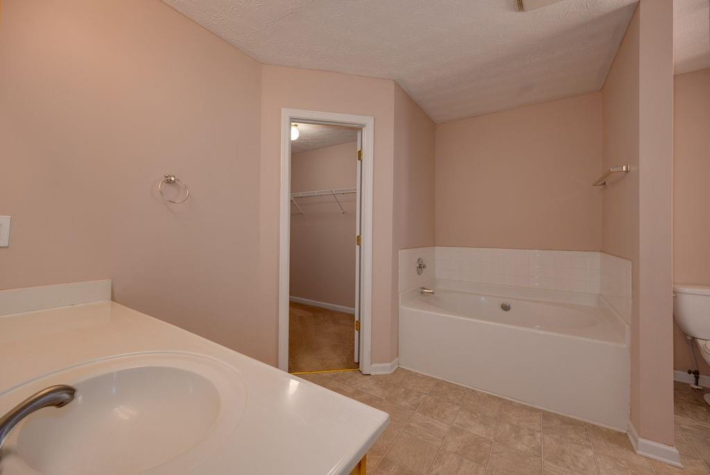 6280 Lake Valley Point Lithonia, GA 30058 - Photo 18 of 30 a bathroom with a bathtub