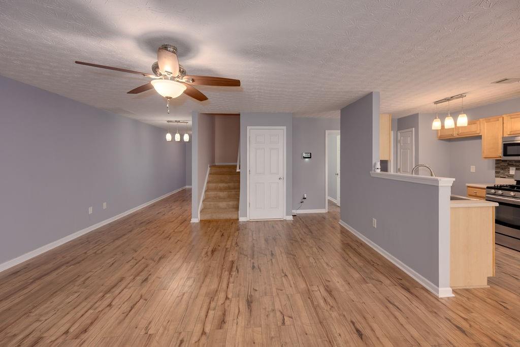 6280 Lake Valley Point Lithonia, GA 30058 - Photo 8 of 30 wooden floor in an empty room with a window