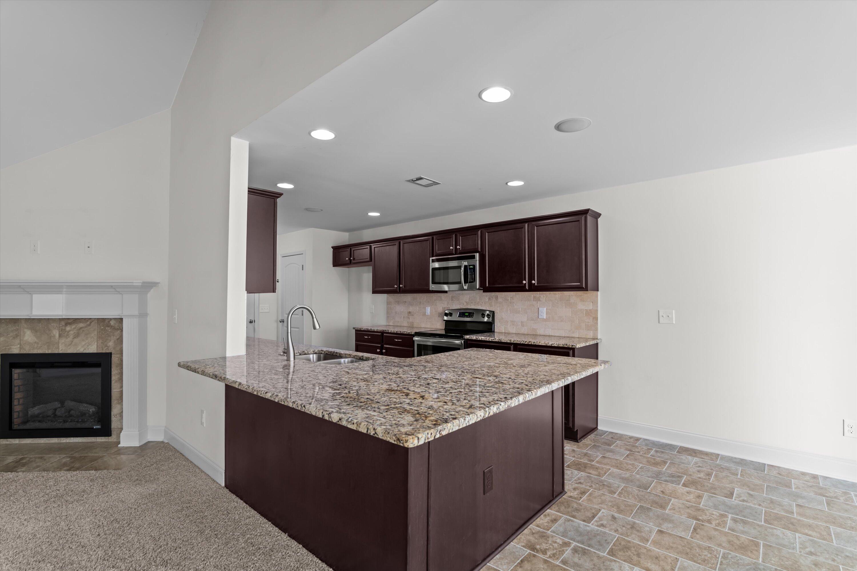 914 Inman Drive Grovetown, GA 30813 - Photo 4 of 22 Kitchen is open to the great room with bar seating