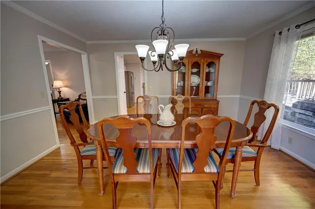 a white toilet sitting next to a shower curtain