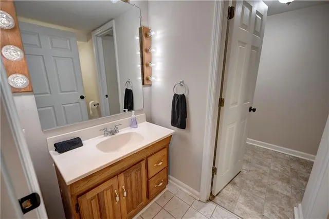 an aerial view of a house with a mountain