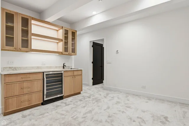 a kitchen with granite countertop cabinets and sink