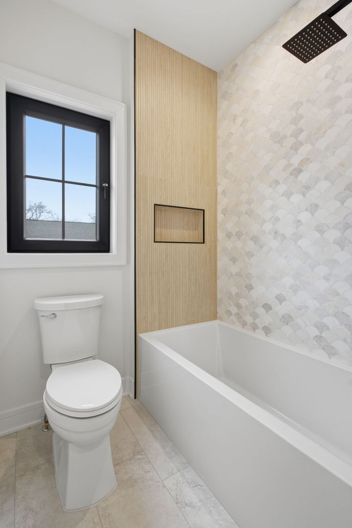 1100 Lois Avenue Park Ridge, IL 60068 - Photo 27 of 41 a white toilet sitting next to a bath tub