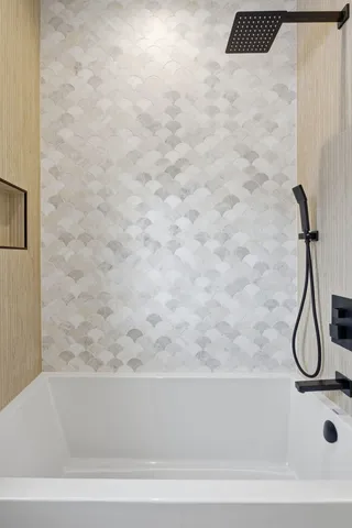 a bathroom with a bath tub