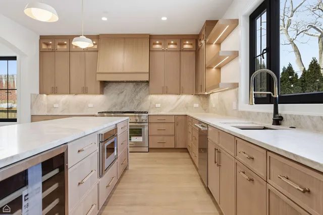 a kitchen with a sink stove and cabinets
