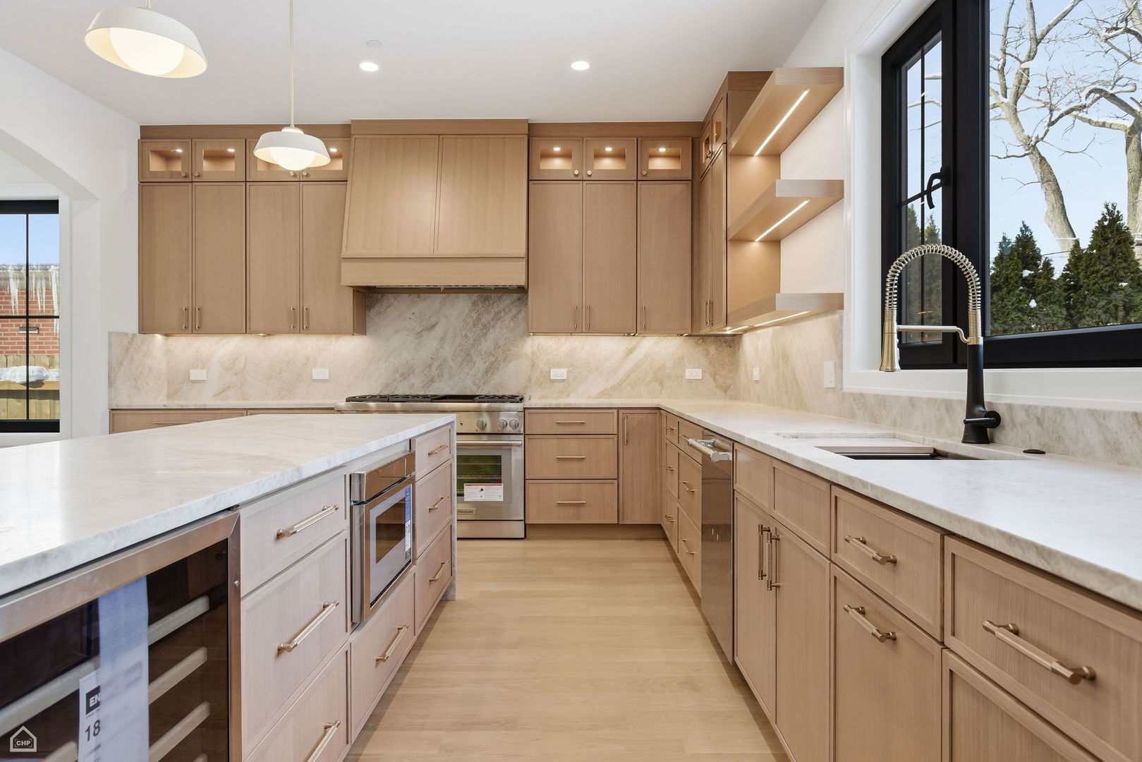 1100 Lois Avenue Park Ridge, IL 60068 - Photo 3 of 41 a kitchen with a sink stove and cabinets