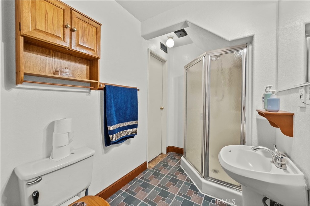 30602 San Martinez Road Val Verde, CA 91384 - Photo 13 of 47 a bathroom with a sink a toilet and shower