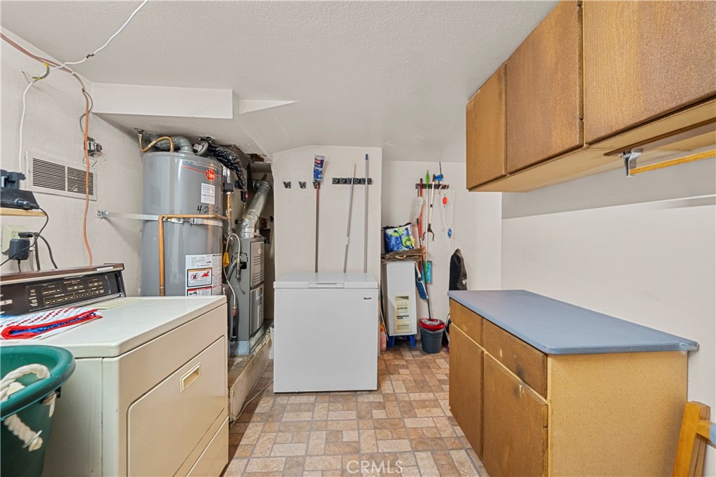 30602 San Martinez Road Val Verde, CA 91384 - Photo 14 of 47 a utility room with dryer and washer