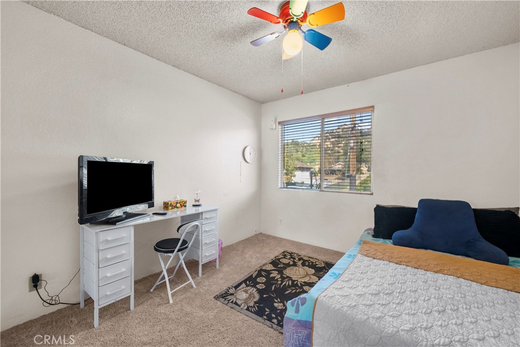 30602 San Martinez Road Val Verde, CA 91384 - Photo 18 of 47 a bedroom with a bed and a window