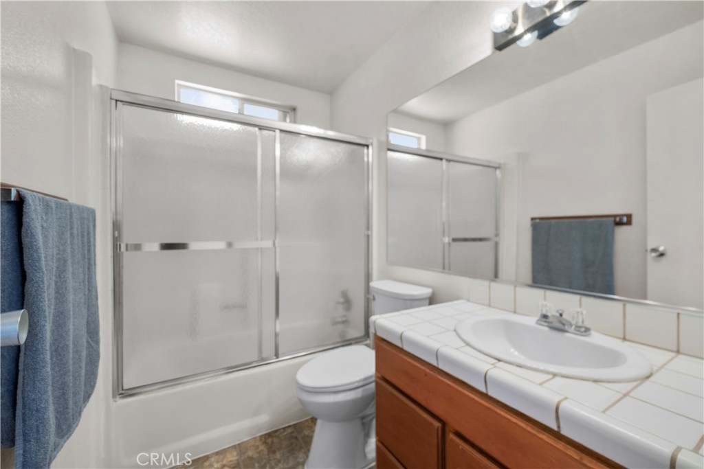 30602 San Martinez Road Val Verde, CA 91384 - Photo 20 of 47 a bathroom with a sink toilet and shower