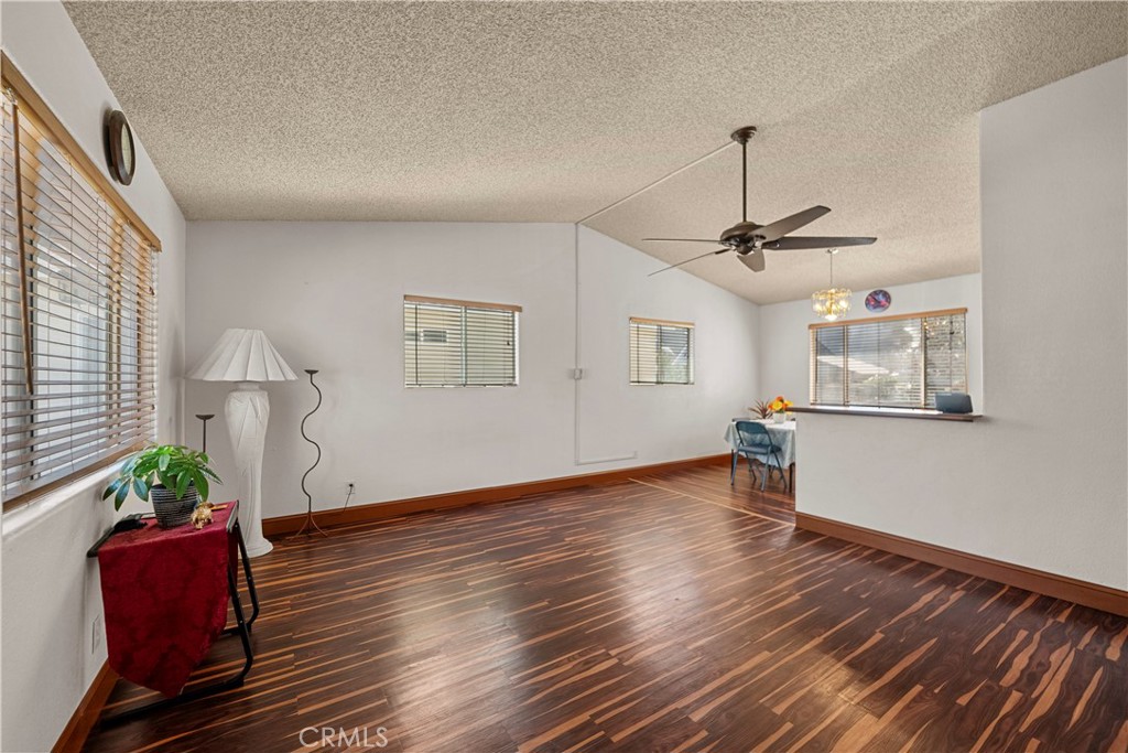 30602 San Martinez Road Val Verde, CA 91384 - Photo 2 of 47 a view of an empty room with wooden floor and a window