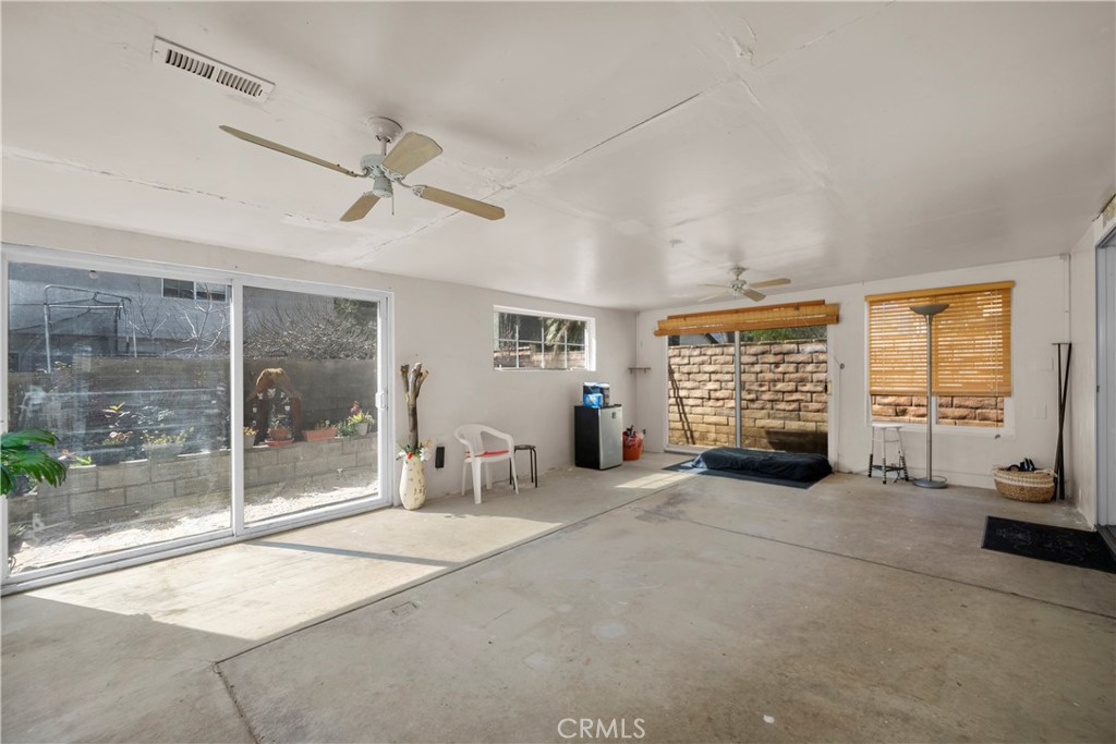 30602 San Martinez Road Val Verde, CA 91384 - Photo 26 of 47 a view of a livingroom with a fireplace and a large window