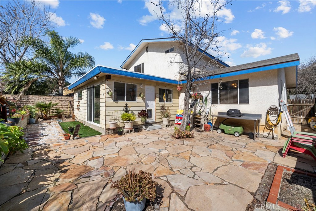 30602 San Martinez Road Val Verde, CA 91384 - Photo 31 of 47 a view of a house with backyard and sitting area