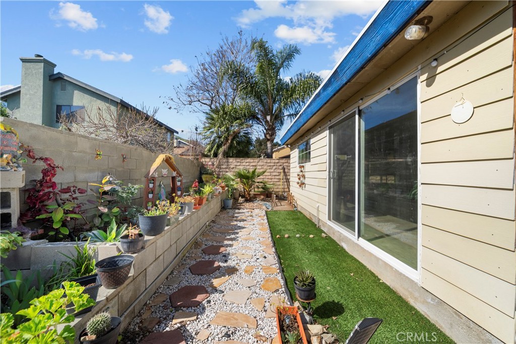 30602 San Martinez Road Val Verde, CA 91384 - Photo 33 of 47 a view of a house with a backyard
