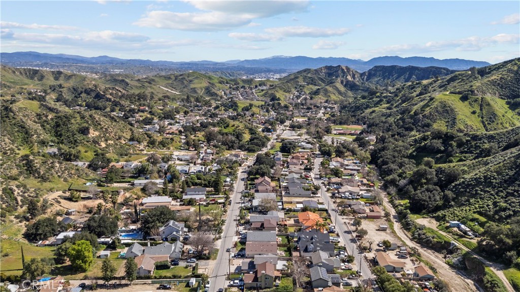 30602 San Martinez Road Val Verde, CA 91384 - Photo 37 of 47 an aerial view of residential house with parking and mountain view