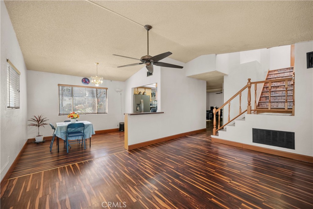 30602 San Martinez Road Val Verde, CA 91384 - Photo 4 of 47 a view of a livingroom with furniture a ceiling fan and wooden floor