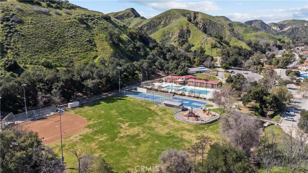 30602 San Martinez Road Val Verde, CA 91384 - Photo 42 of 47 a view of a swimming pool with a yard