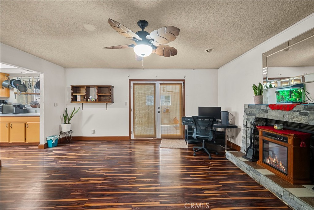 30602 San Martinez Road Val Verde, CA 91384 - Photo 9 of 47 a living room with furniture and a fireplace