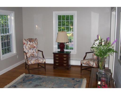 11 James Road Reading, MA 01867 - Photo 2 of 9 a living room with furniture and a potted plant