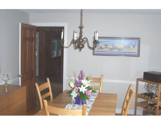 11 James Road Reading, MA 01867 - Photo 4 of 9 a view of a dining room with furniture and wooden floor