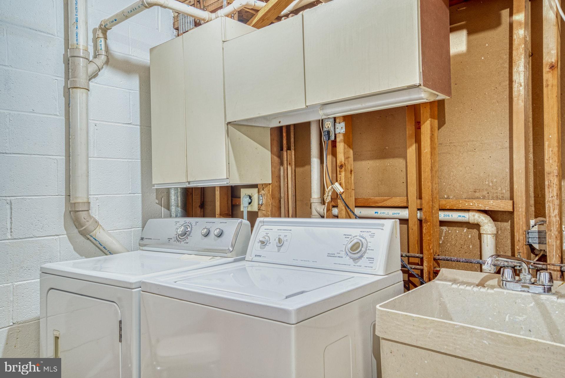 11133 Watermans Drive Reston, VA 20191 - Photo 50 of 56 Laundry room has storage and shelving