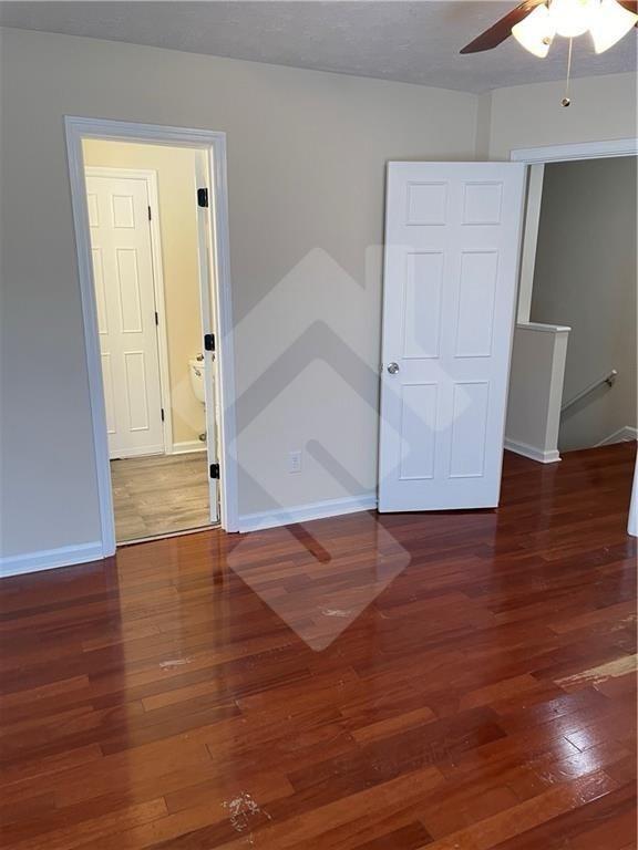 4267 Grogan Street Acworth, GA 30101 - Photo 23 of 37 an empty room with wooden floor and cabinet