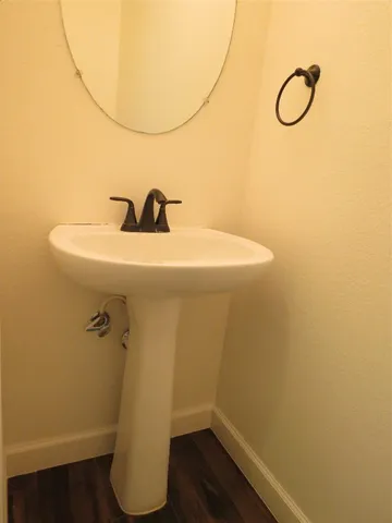 a bathroom with a sink and mirror