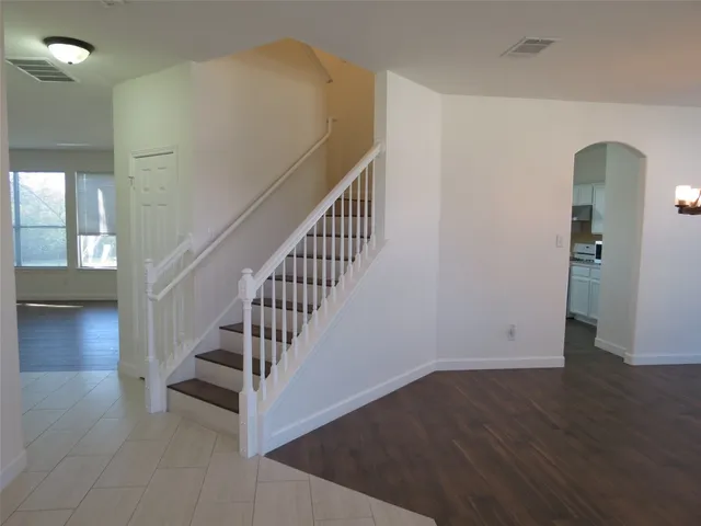 a view of entryway with wooden floor