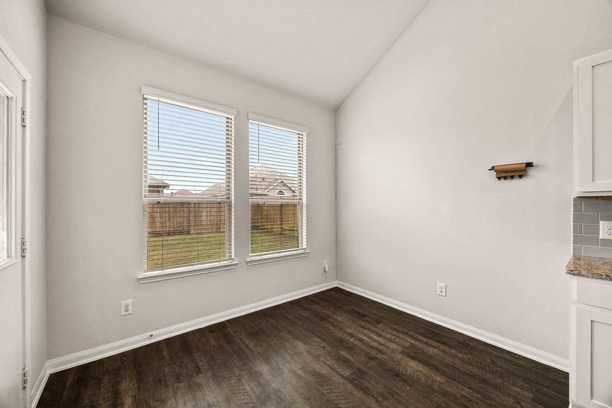 15731 Ty Cobb Court Splendora, TX 77372 - Photo 11 of 36 an empty room with wooden floor and windows