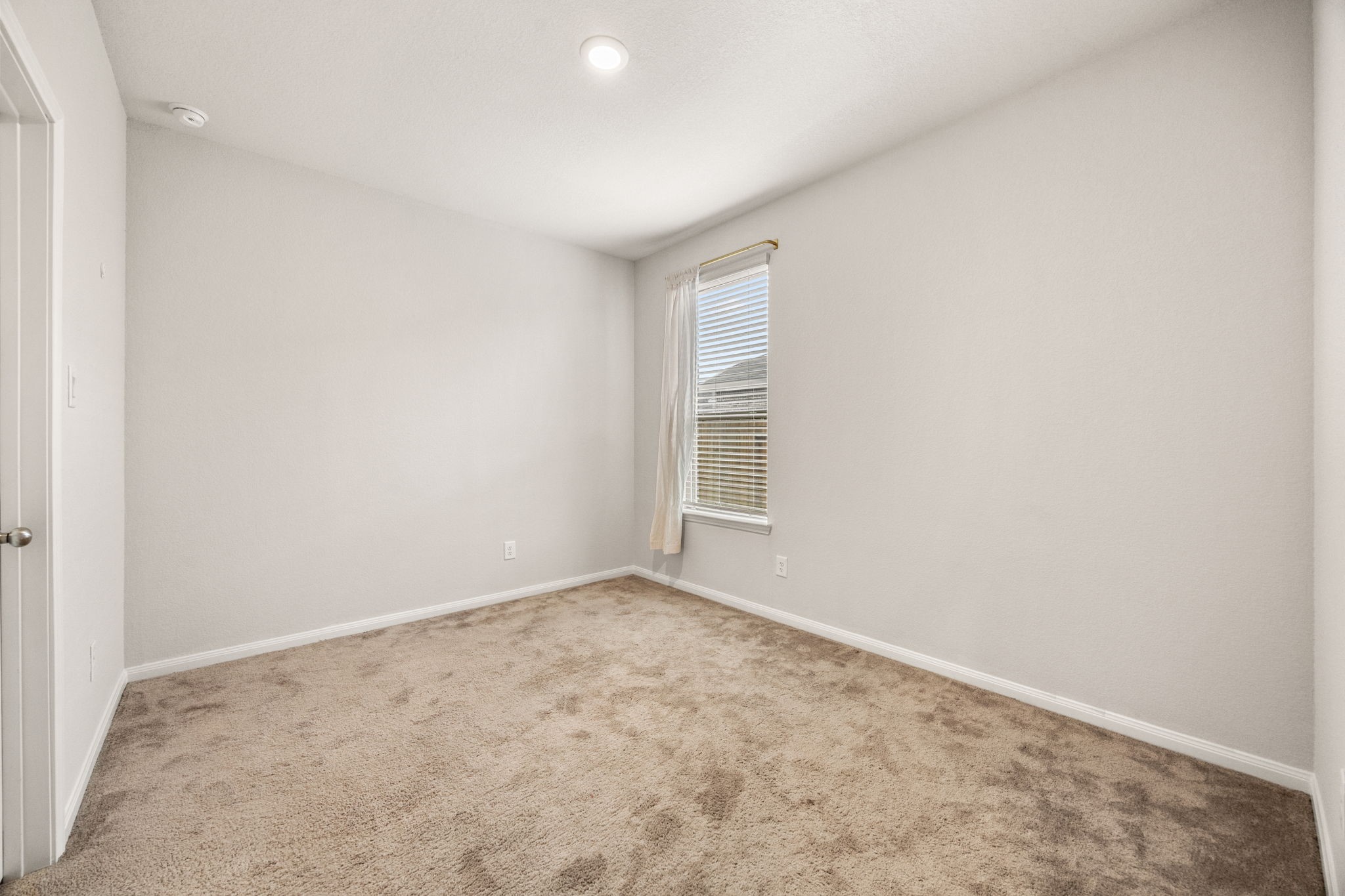 15731 Ty Cobb Court Splendora, TX 77372 - Photo 23 of 36 an empty room with windows