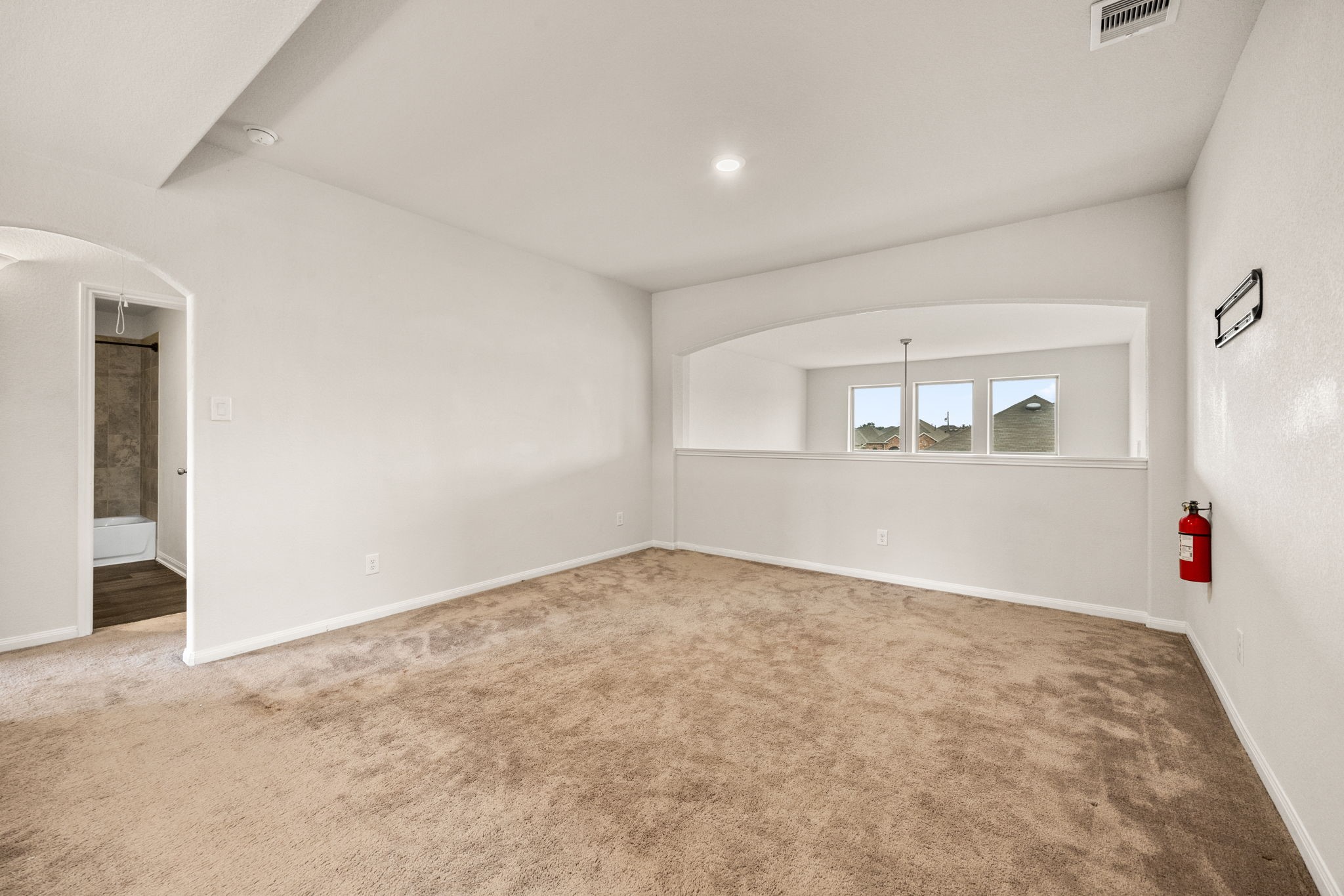 15731 Ty Cobb Court Splendora, TX 77372 - Photo 26 of 36 an empty room with wooden floor and windows