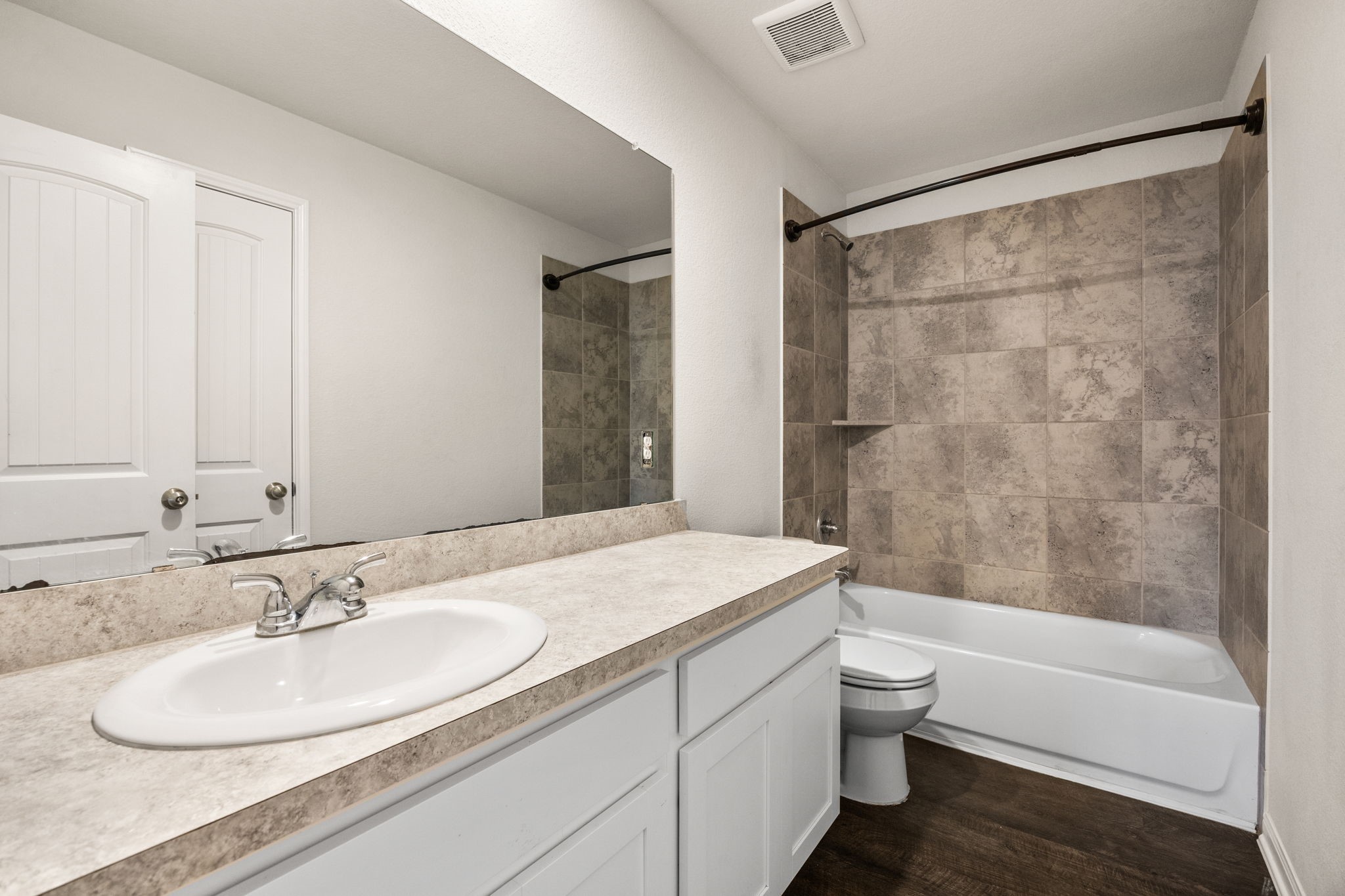 15731 Ty Cobb Court Splendora, TX 77372 - Photo 31 of 36 a bathroom with a granite countertop sink and a mirror