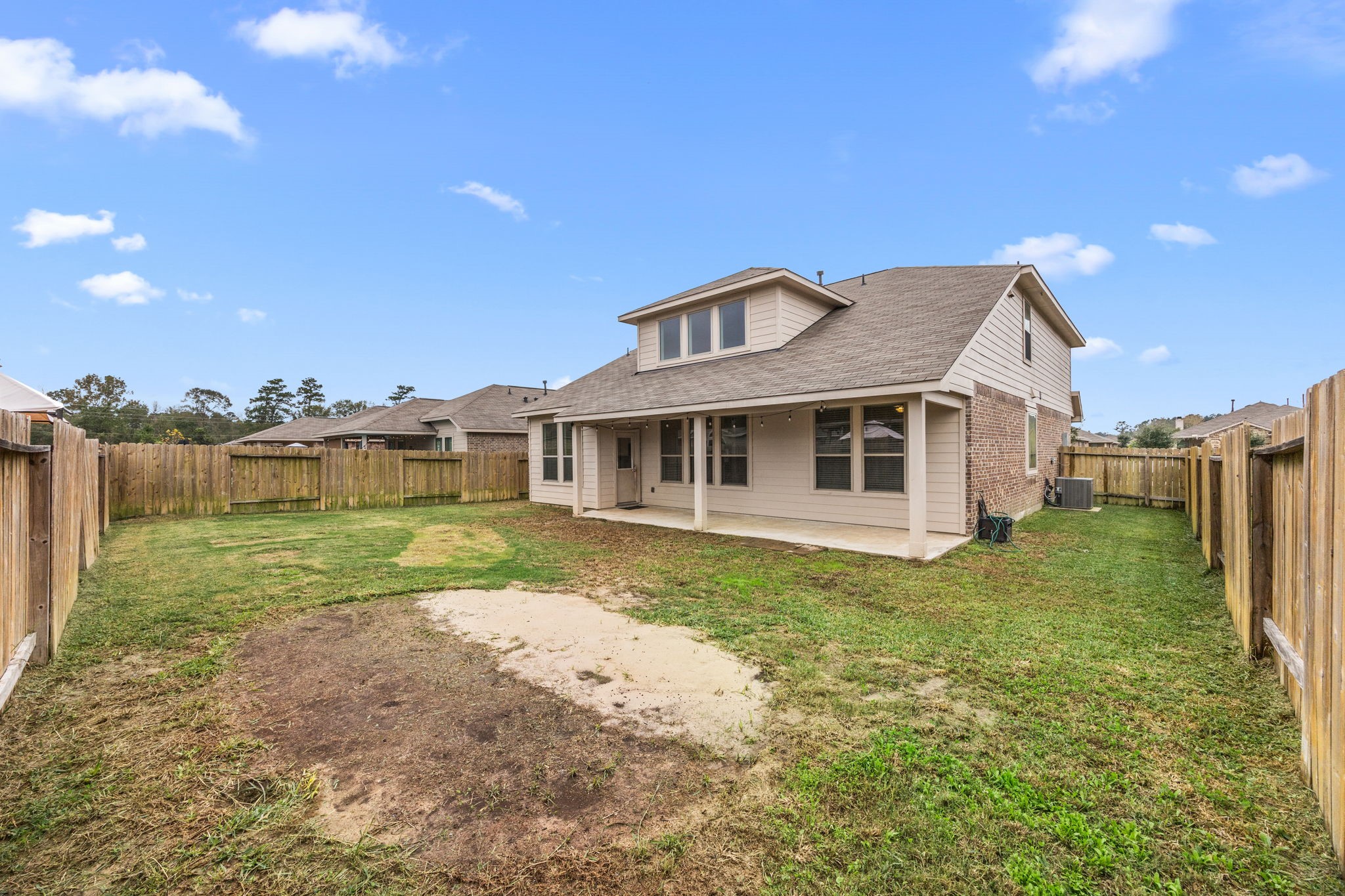 15731 Ty Cobb Court Splendora, TX 77372 - Photo 34 of 36 a front view of a house with a yard