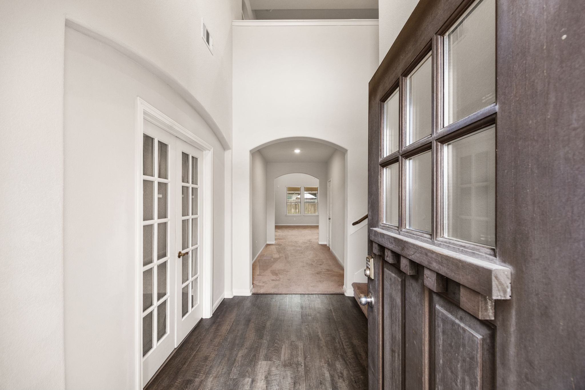15731 Ty Cobb Court Splendora, TX 77372 - Photo 4 of 36 a view of a hallway with wooden floor and staircase