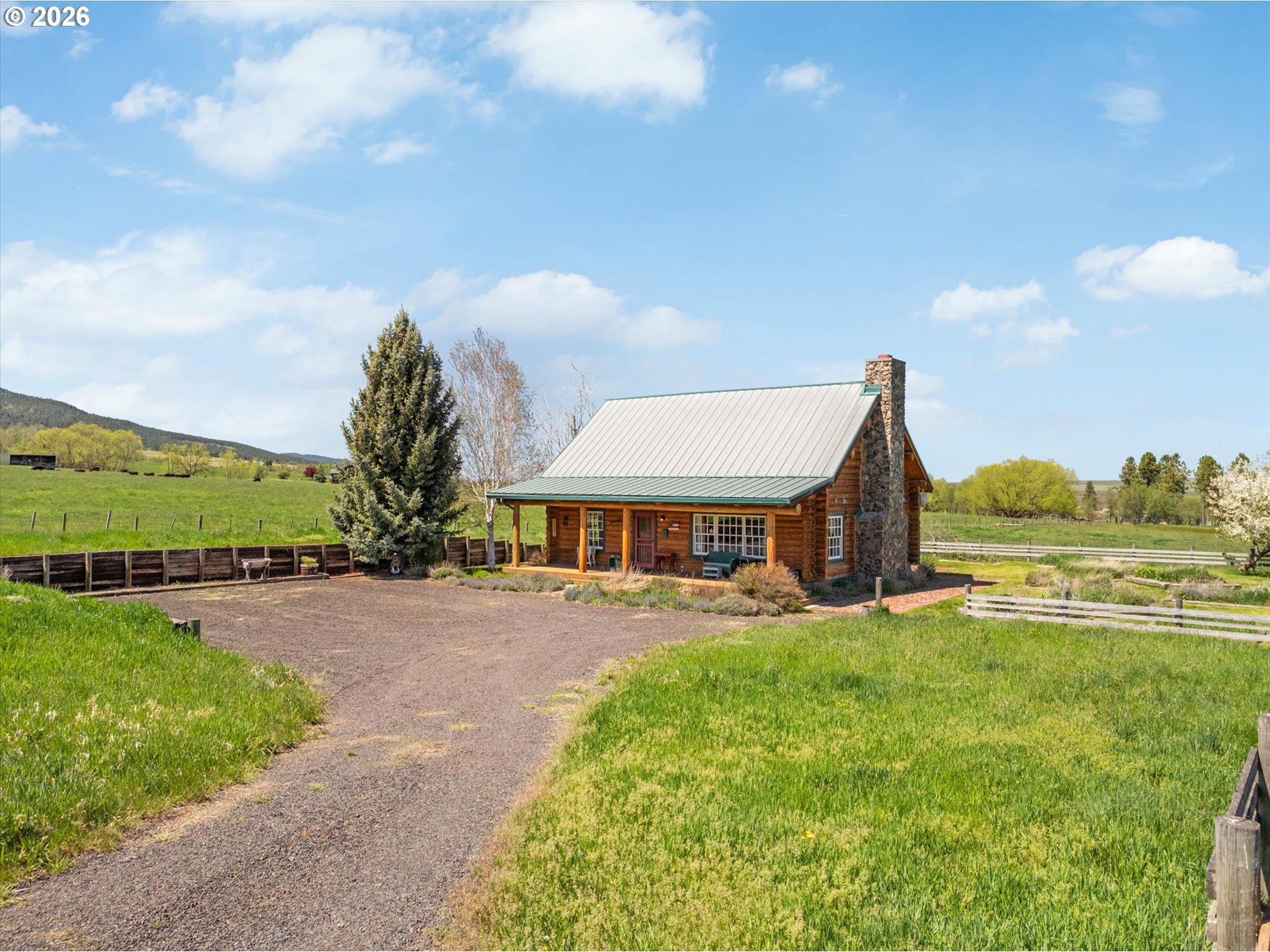 64782 Alder Slope Road Enterprise, OR 97828 - Photo 3 of 48 a front view of a house with garden
