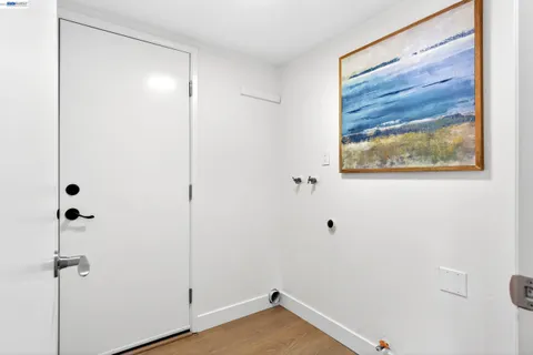 a view of bathroom with a toilet sink and mirror