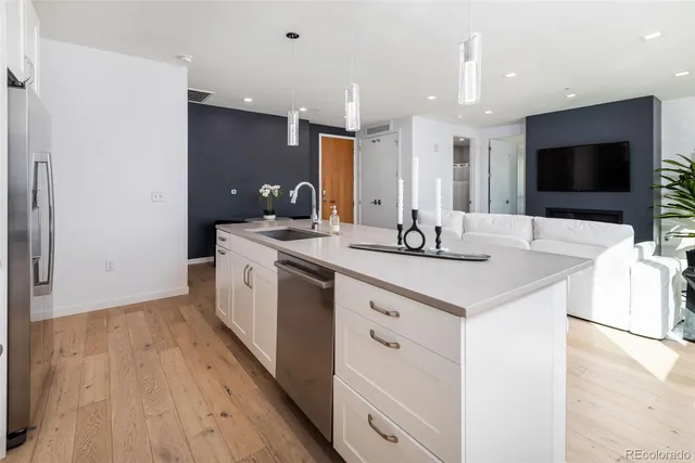 a kitchen with a sink and a refrigerator