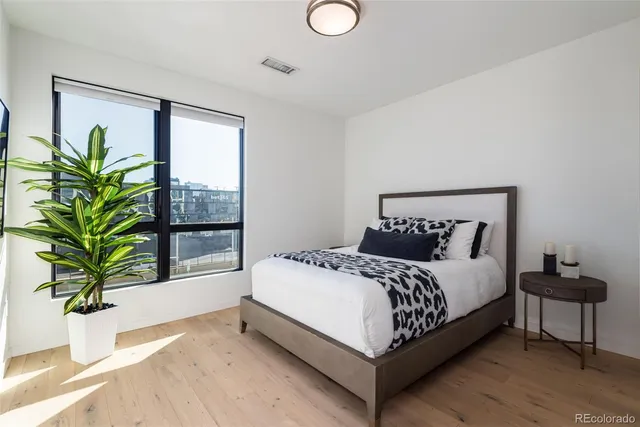 a bedroom with a bed and window