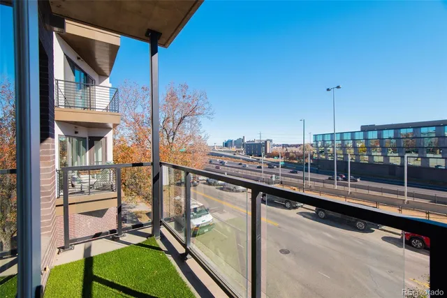 a view of a glass door with a balcony