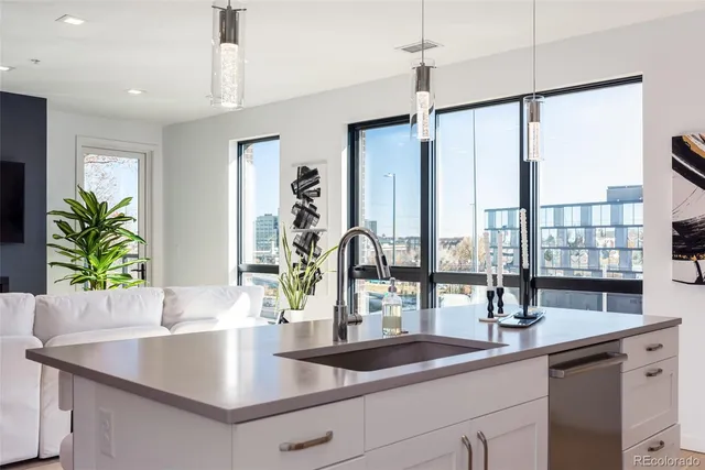 a kitchen with a sink and window