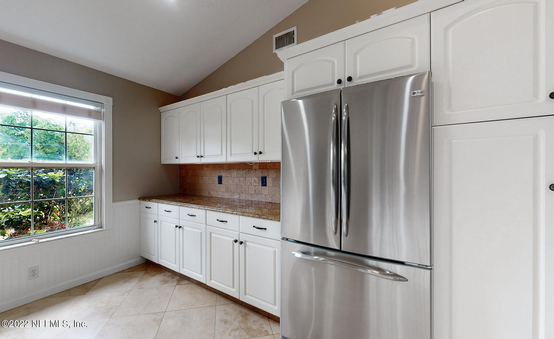 114 Harvard Road St. Augustine, FL 32086 - Photo 10 of 32 a kitchen with stainless steel appliances a refrigerator sink and cabinets