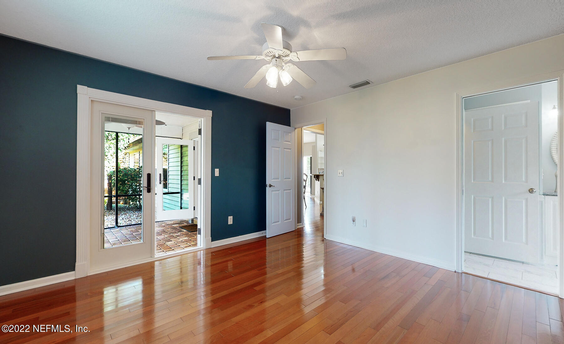 114 Harvard Road St. Augustine, FL 32086 - Photo 14 of 32 wooden floor in an empty room with a window
