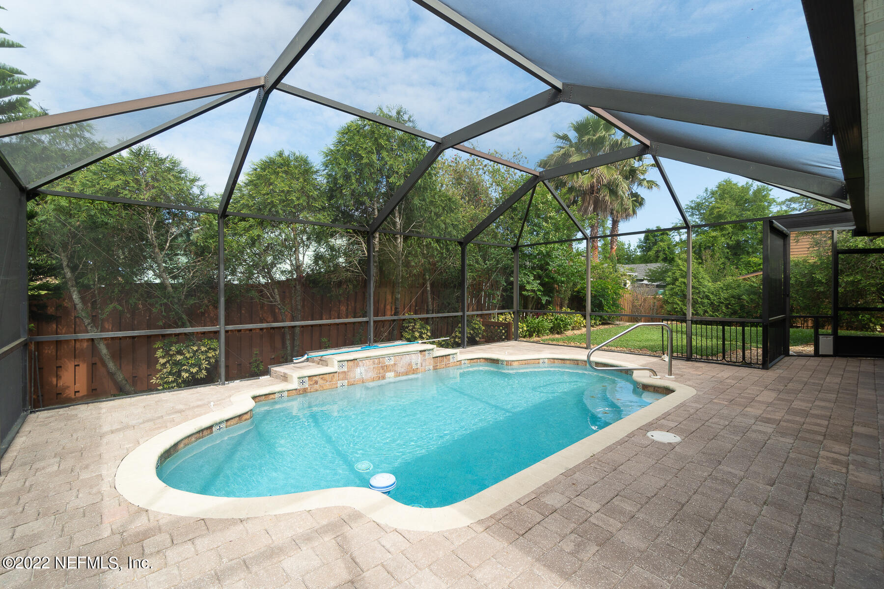 114 Harvard Road St. Augustine, FL 32086 - Photo 25 of 32 a view of a swimming pool with a backyard