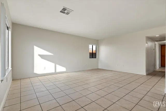 a large kitchen with stainless steel appliances granite countertop a sink and cabinets