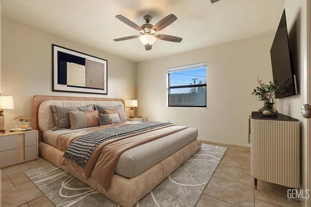 an empty room with windows and ceiling fan