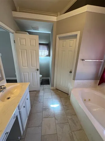 a view of a kitchen with a sink and a fireplace