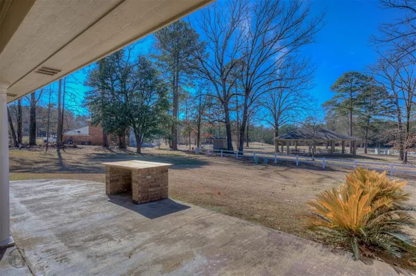a view of patio with a yard