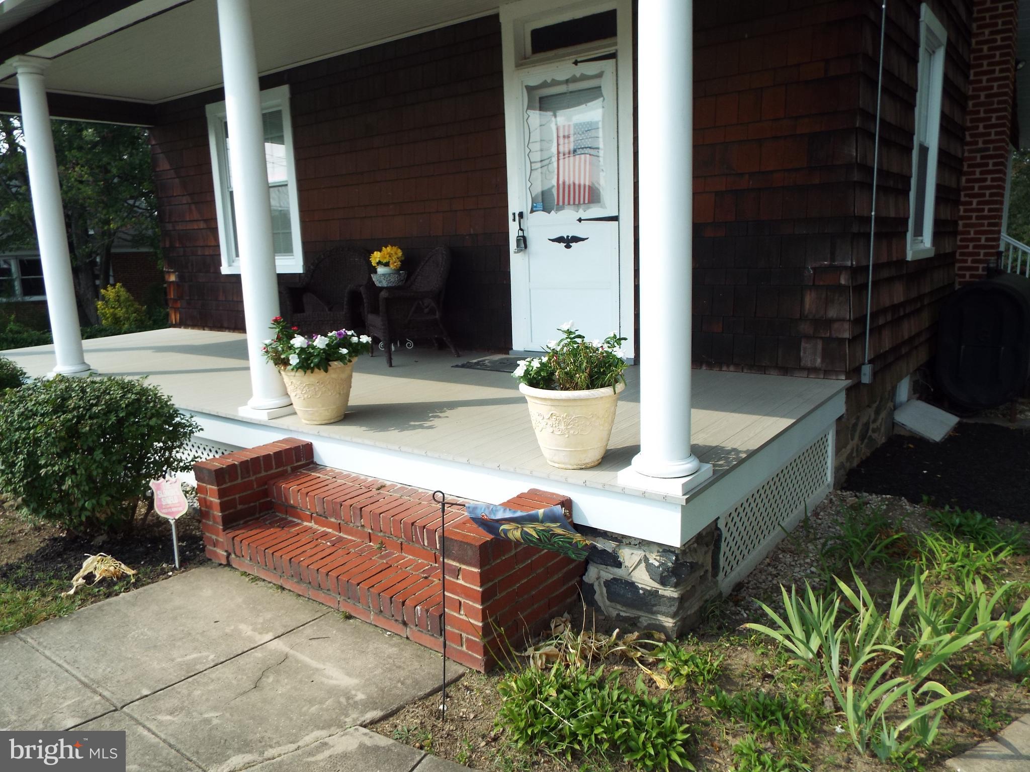 7210 Dogwood Road Baltimore, MD 21244 - Photo 2 of 36 Sip your favorite drink on the charming porch.